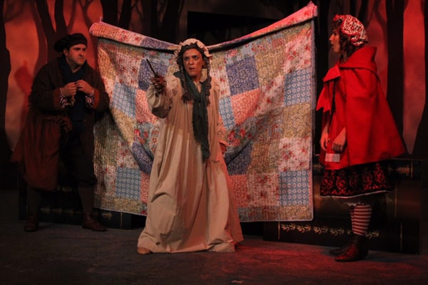 Female actors on stage acting in a play